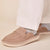 sandstone suede slip-on mule shoe with strap, worn with gray socks and white pant hem