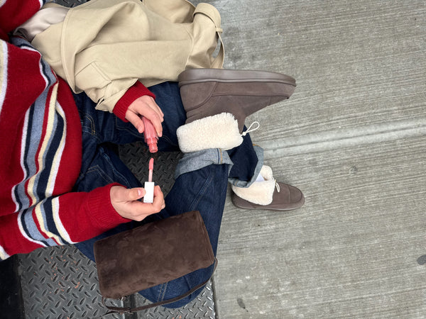 Top down view of Apres Boot Nubuck in camel showcasing fold down shearling cuff and nubuck upper on cuffed jeans