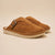 Tan suede slip-on clogs with metal buckle, pair shown angled left; 'brunch' embossed on outer sole.