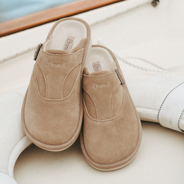 Pair of sandstone suede slip-on clogs with 'Brunch' embroidered on the upper