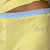 Yellow pajama shorts with light-blue waistband, three white buttons and "Brunch" embroidery near the hip