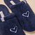 Navy terry slippers with white embroidered heart and fabric tags reading Casa Tua Brunch and a small 'B' logo.