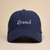 Navy baseball cap with white embroidered script 'Brunch' on the front