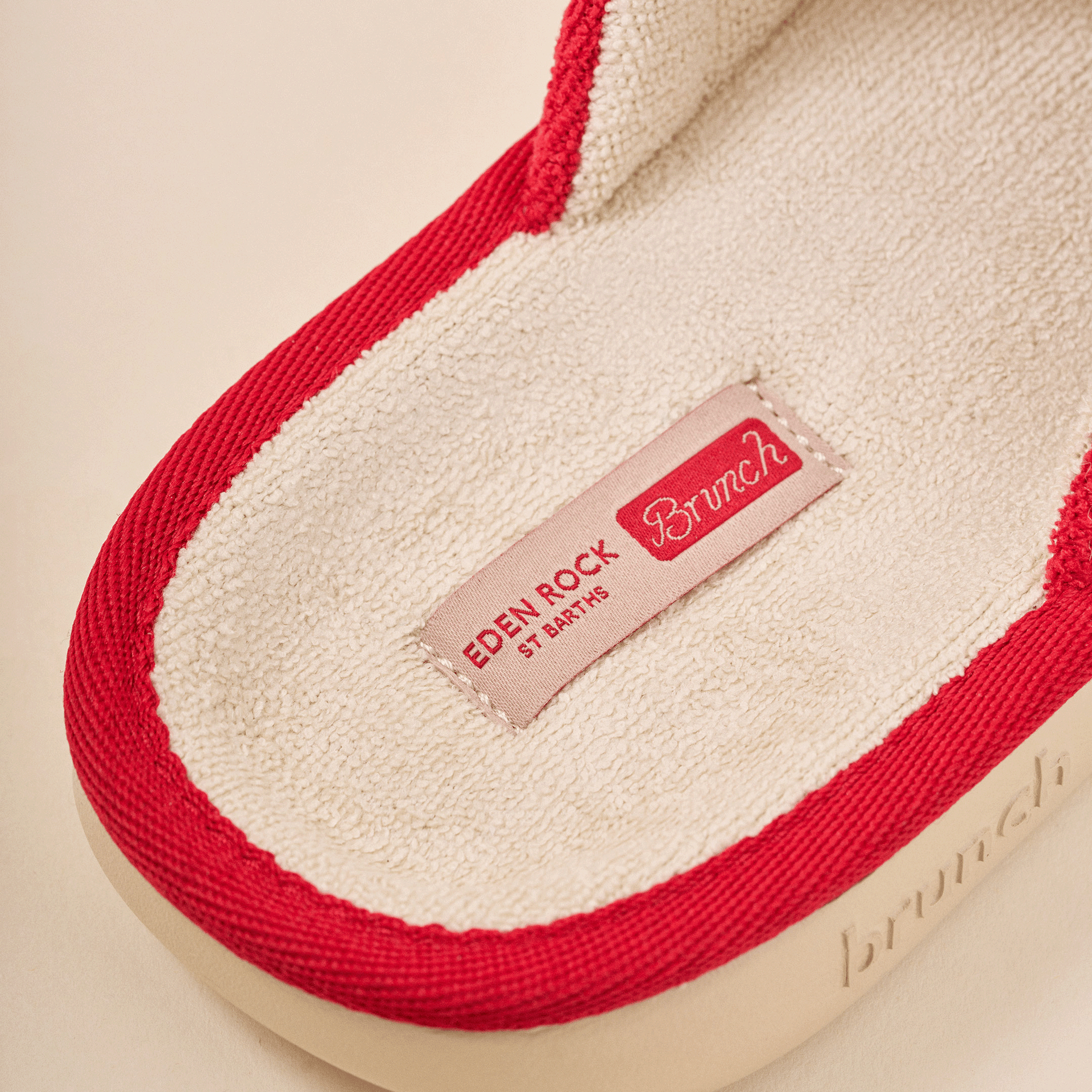 Slipper insole with red trim and terry lining; fabric label reads EDEN ROCK ST BARTHS, script 'Brunch' and embossed 'brunch'.