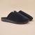 Navy sherpa slip-on slippers with black molded sole, backless mule style and tan logo tab