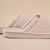 Cream sherpa slide slipper with "Brunch" embossed on the sole.