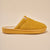 Mustard-yellow fuzzy slip-on slipper, side view with Brunch embossed on the sole