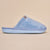 Powder-blue plush slip-on slipper, side view; Brunch logo embossed on sole