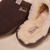 Brown suede slippers with cream shearling lining, embroidered 'Brunch' and small 'B' logo on the heel.