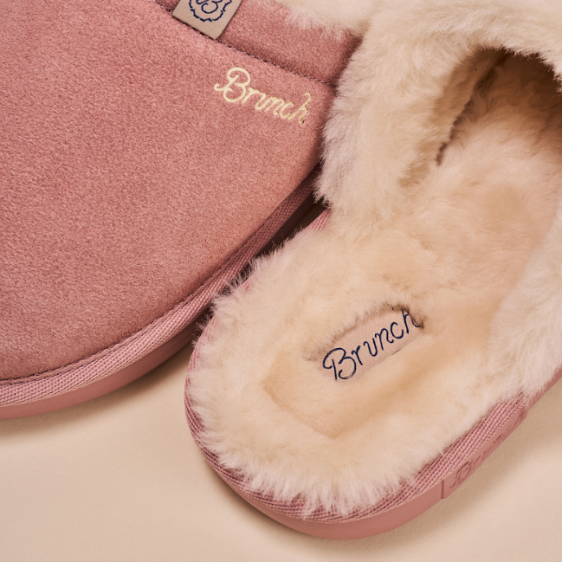 Mauve suede slippers with cream faux-fur lining and embroidered 'Brunch' on insole and upper.