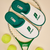 White and green prince slippers resting on a tennis racket with yellow tennis balls