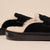 Black suede shearling-lined slide with Brunch embossed on the sole