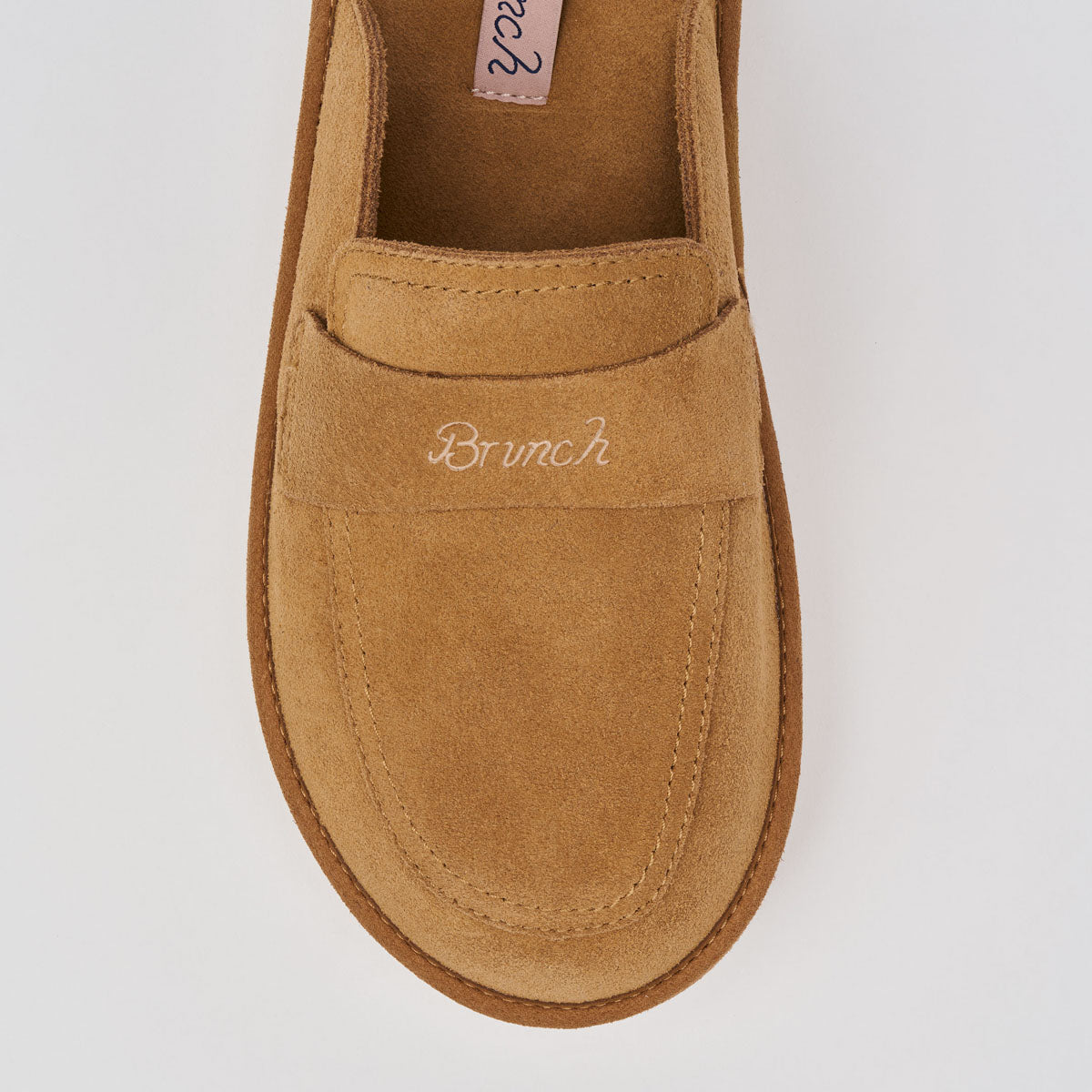 Top view of Loafer in Honey suede showcasing embroidered Brunch strap and cushioned suede upper on white background