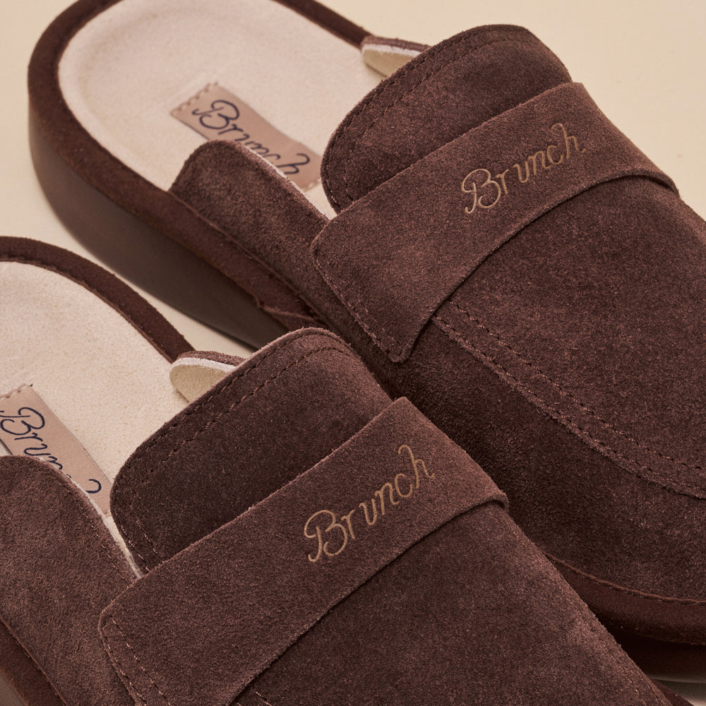 Brown suede slip-on slippers with 'Brunch' embroidered on the strap and a 'Brunch' insole label.