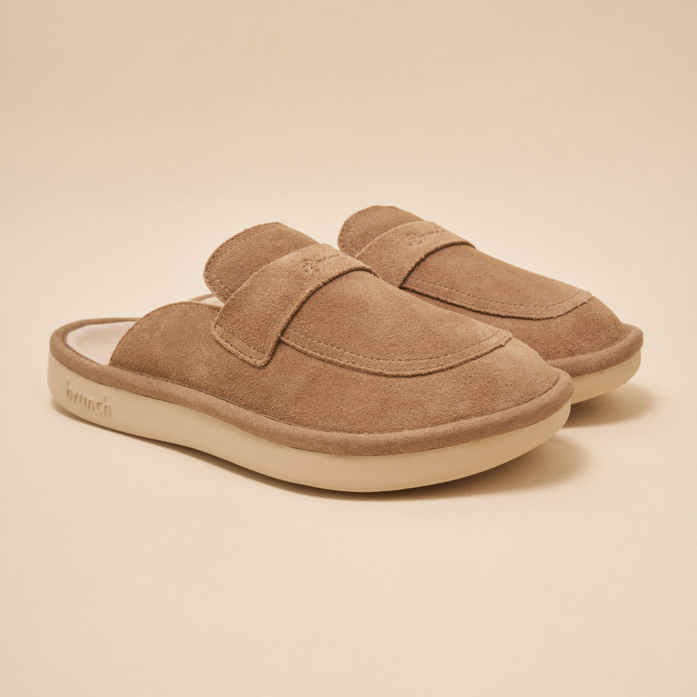 pair of sandstone suede slip-on mules with cushioned cream sole