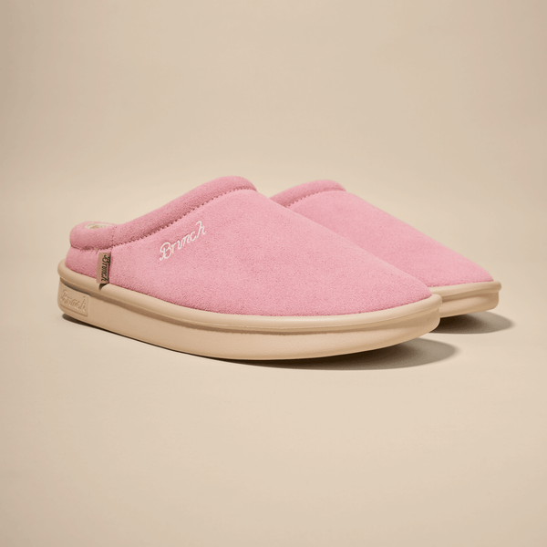 pink suede slip-on slippers with "Brunch" embroidered on the side