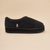 Black sherpa slip-on slipper with thick platform sole and small fabric side tag