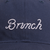 Navy baseball cap with white embroidered cursive 'Brunch' on front