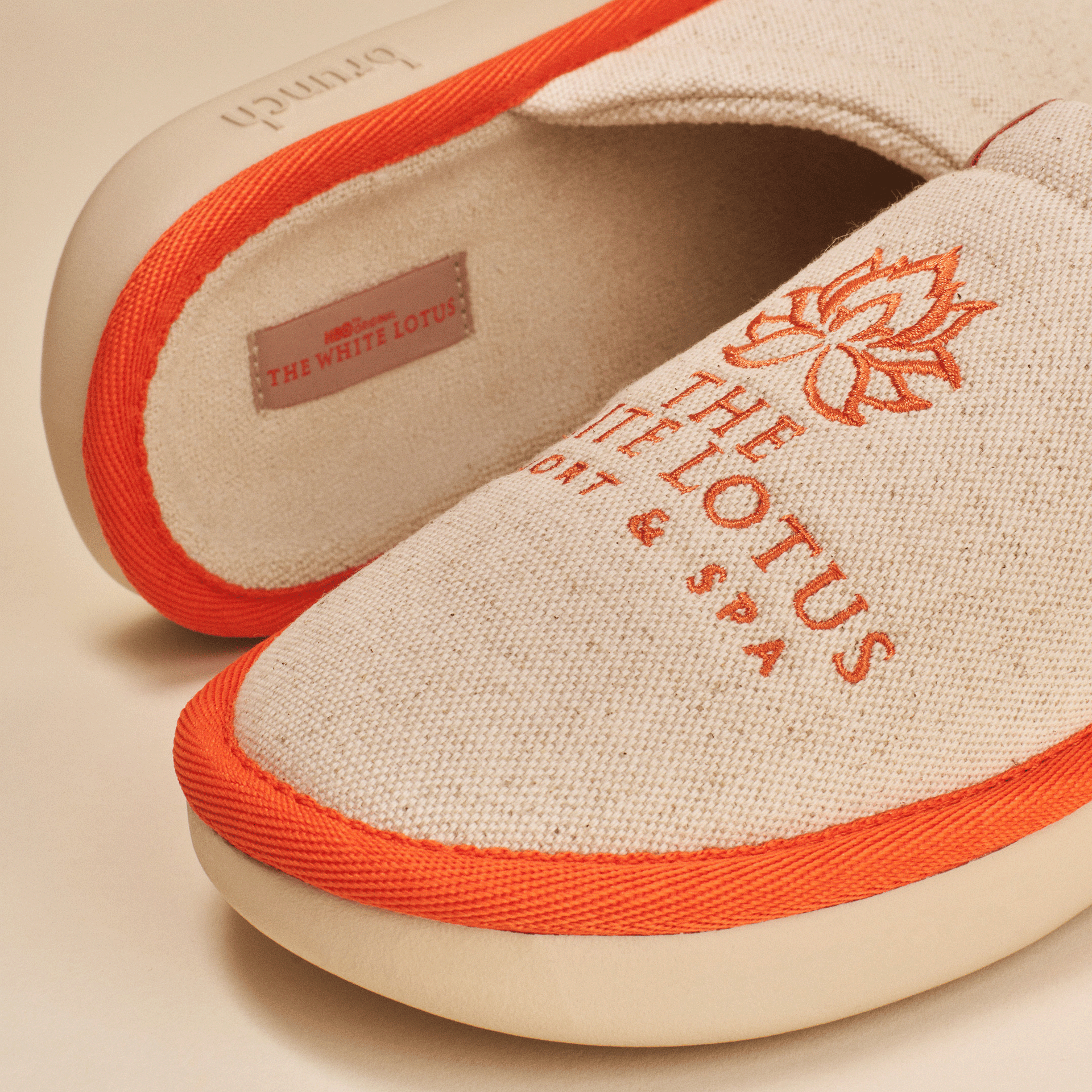 Beige canvas spa slippers with orange trim and lotus logo embroidered THE WHITE LOTUS RESORT & SPA