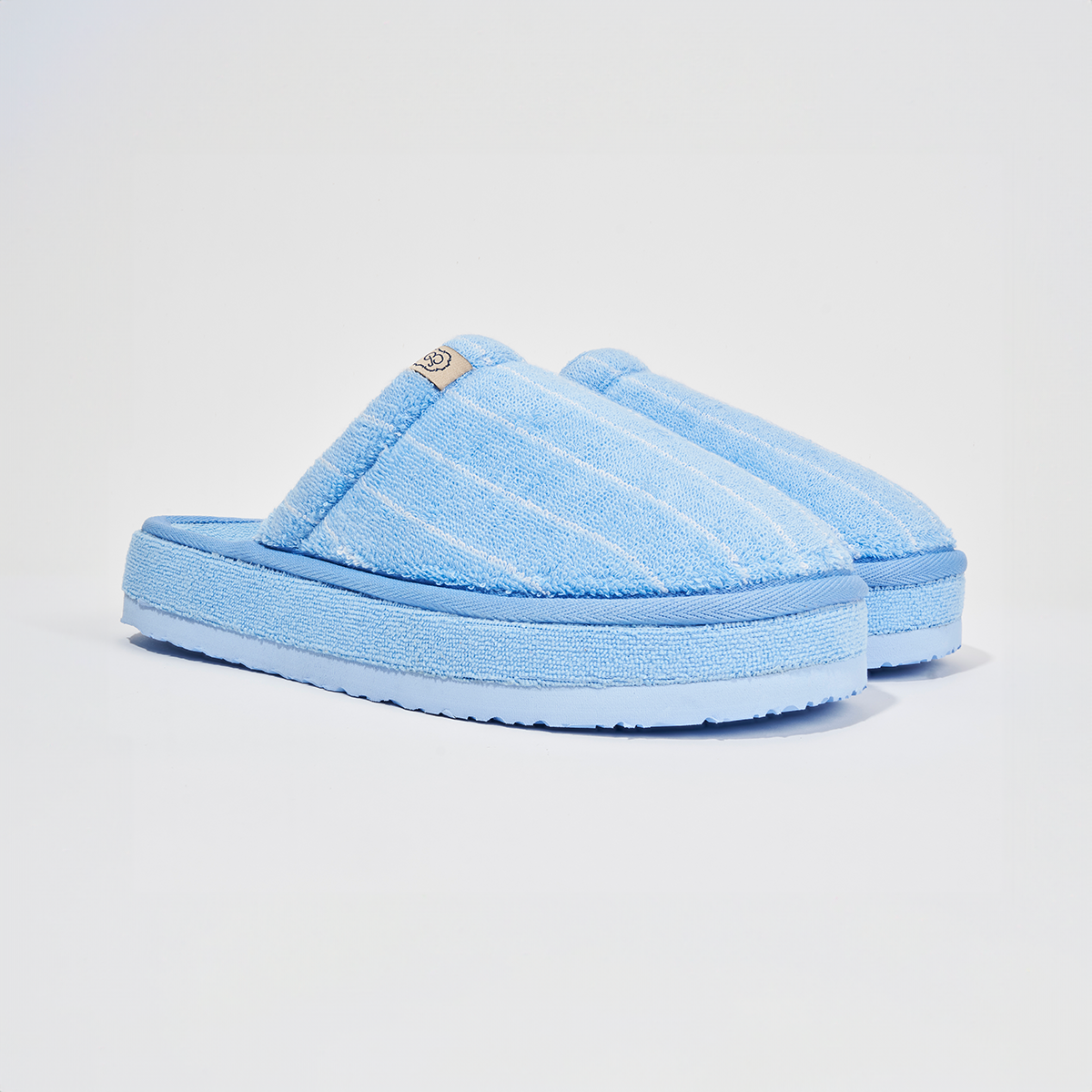 Three quarter view of Cabana Essential XXL slipper in blue striped terry showing terry upper and thick platform sole on white