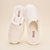 Top view of Classic cream terry slippers showing plush terry upper and slip-on mule shape on neutral background