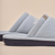 Side view of Essential Cashmere slipper in baby blue showing cashmere upper and navy embossed outsole
