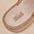 Close-up of Essential Corduroy slipper interior showing terry footbed and stitched Brunch label on caramel corduroy trim