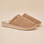 Side view of Essential Corduroy slipper in caramel showing ribbed corduroy upper and low profile outsole on beige background