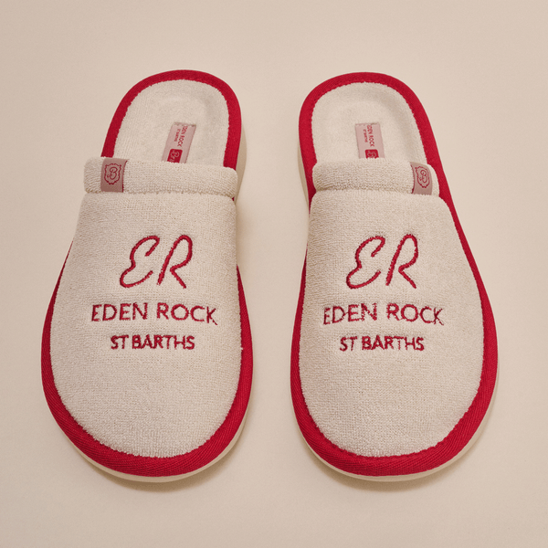 Overhead view of beige terry Eden Rock slippers with red trim showing red embroidered ER Eden Rock St Barths on top