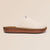 Side view of beige Essential Floral canvas slipper with sunflower embroidery and brown cushioned sole on neutral background