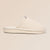 Side view of Essential Floral canvas slipper in beige Wildflower showcasing hand-stitched floral embroidery on a neutral beige background