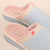 Angled close-up of French Blue Cozyland slip-on slipper showing pink terry lining, embroidered Zs and sun logo