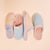 Top-down view of Essential Cozyland slippers in French Blue with pastel stripes and solids, terry lining on pale peach