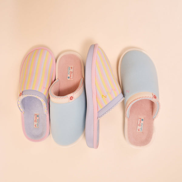 Top-down view of Essential Cozyland slippers in French Blue with pastel stripes and solids, terry lining on pale peach