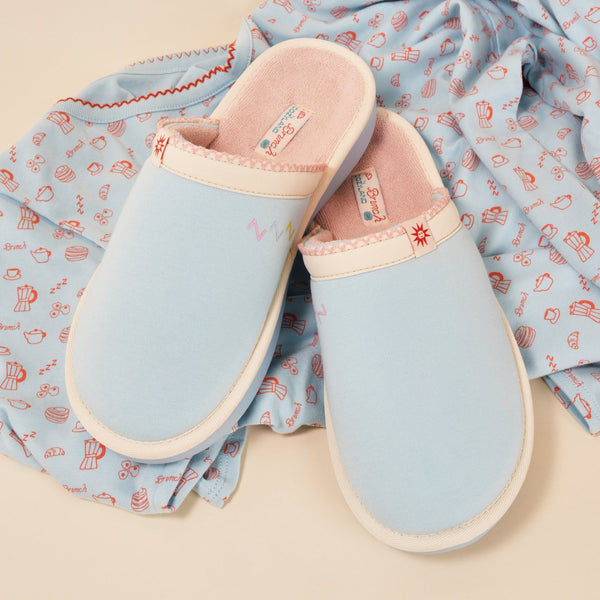 Top view of Essential Cozyland slippers, French Blue, showing pink terry lining and cushioned sole on printed pajama fabric