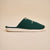Side view of green Essential slipper with embroidered Beverly Hills Hotel logo and white EVA sole on beige background