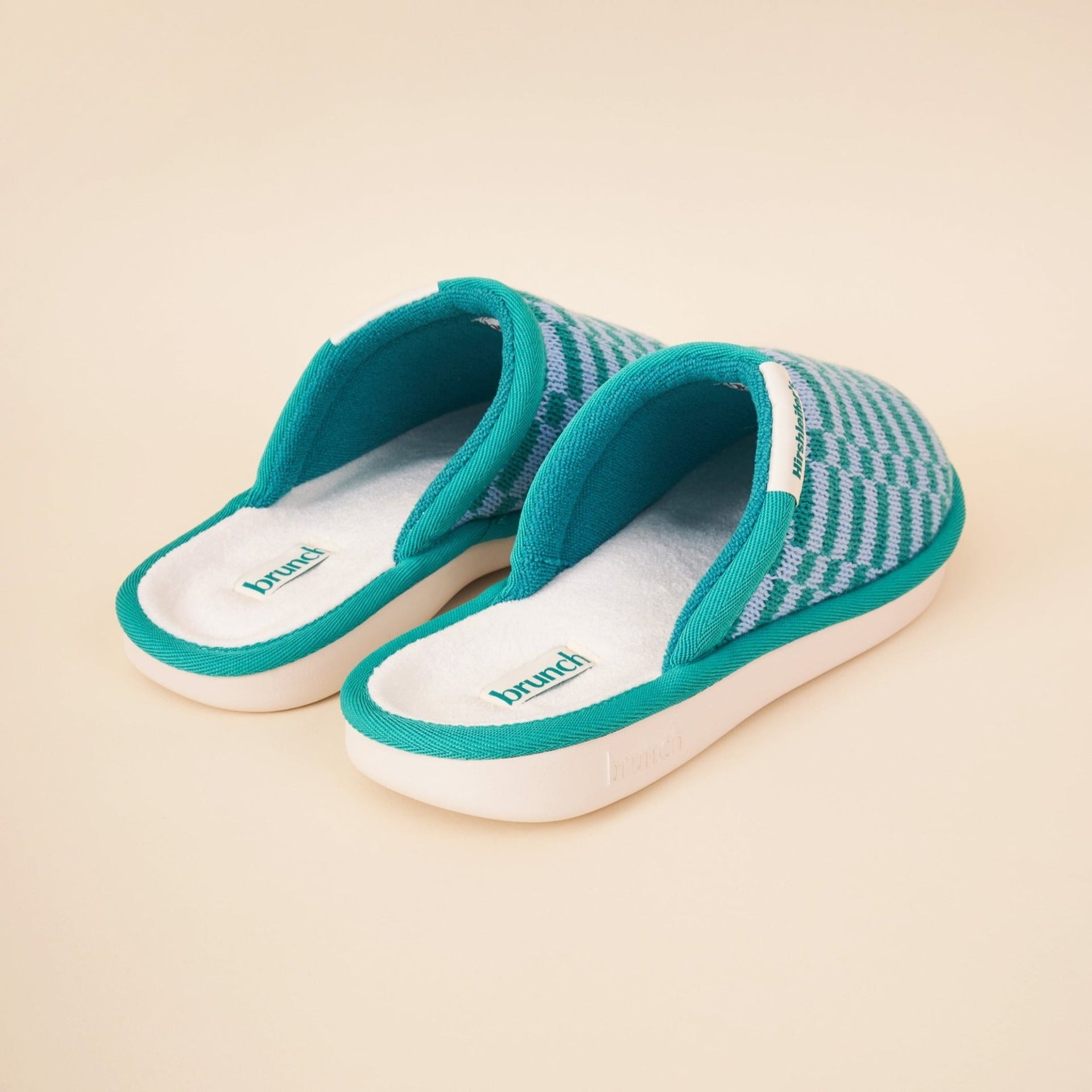Three-quarter view of Essential Hirshleifers marine slippers showing teal-gray knit upper and cushioned white terry footbed