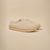 Three quarter view of Essential Kids slipper in beige terry with cushioned EVA sole on neutral background