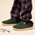 Three quarter view of Essential Kids slipper in emerald terry showing terry upper and cream EVA outsole on neutral background