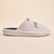 Side view of Essential Parke Varsity fleece slipper showcasing light gray fleece upper, navy terry lining, embroidered PA logo on beige background