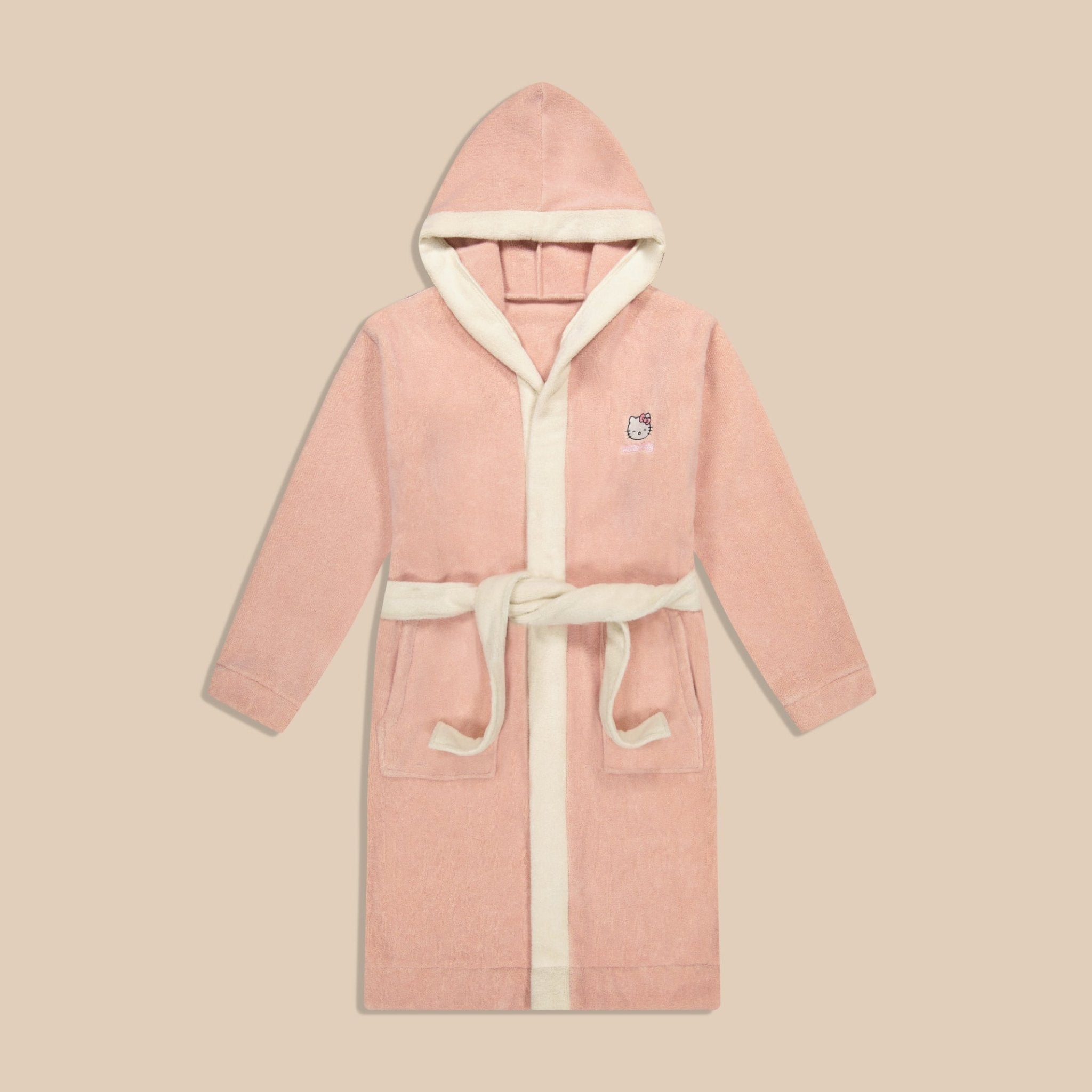 Front view of pink hooded robe with Hello Kitty embroidery, contrast cream trim, pockets, and belt on beige background