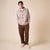 Front view of Essential Shearling slipper on model showcasing beige suede upper and plush shearling lining on neutral background