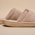 Side view of beige Essential Slipper showing soft terry upper, open-toe slide silhouette and embossed Brunch sole on neutral background