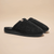 Angled view of Essential Spring slip-on shoe showing low-profile silhouette and rounded toe on white background