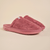Three-quarter view of Essential Slipper in dusty rose terry cloth showcasing cushioned sole and open-back design on beige background