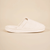 Side view of Essential Spring slipper with cream terry upper and cushioned sole embossed with brunch on neutral background