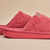 Side view of Essential slipper in pink showing plush terry upper and sole embossed with brunch on neutral background