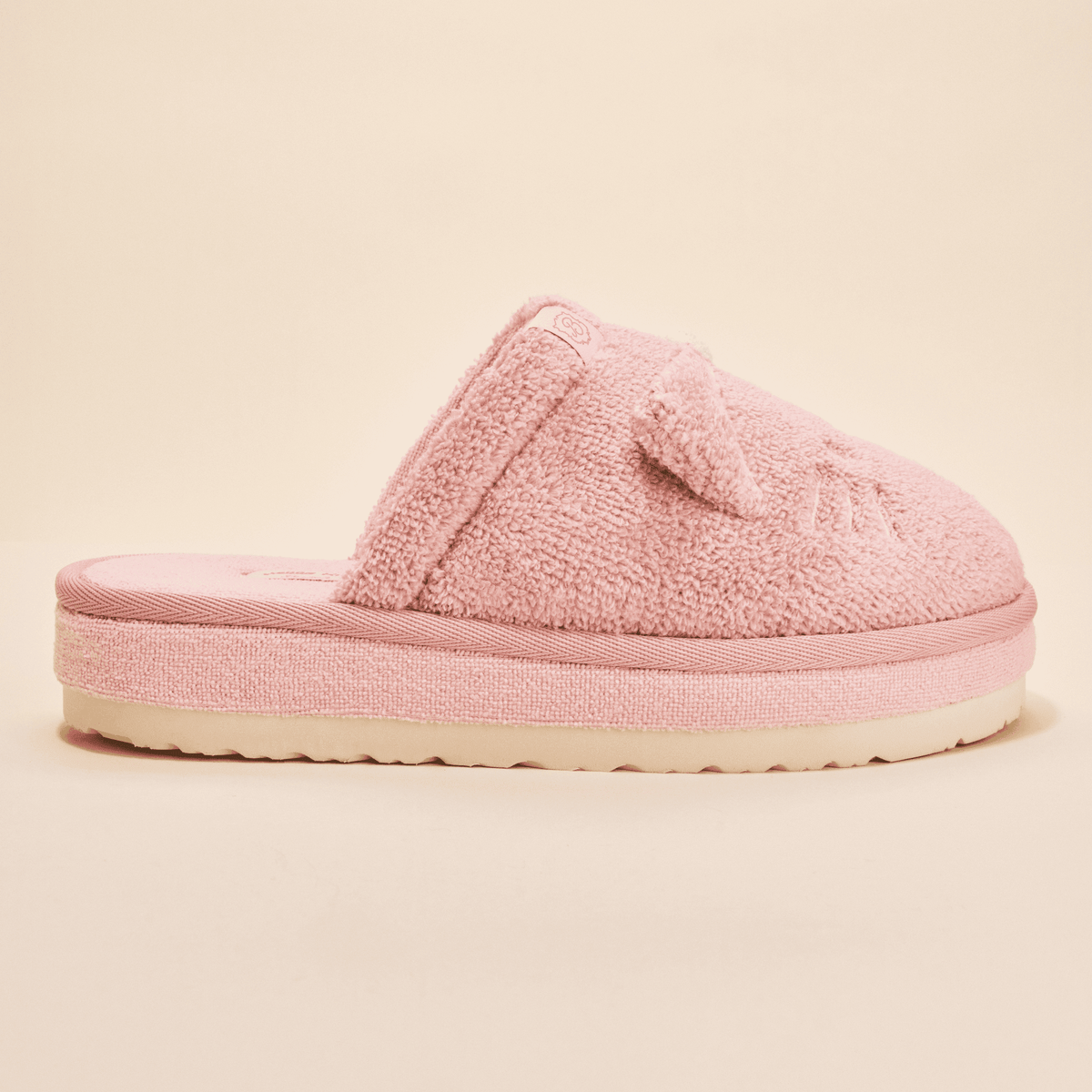 Side view of Essential XXL Hello Kitty slipper showing pink terry upper with 3D ears and bow and thick sole