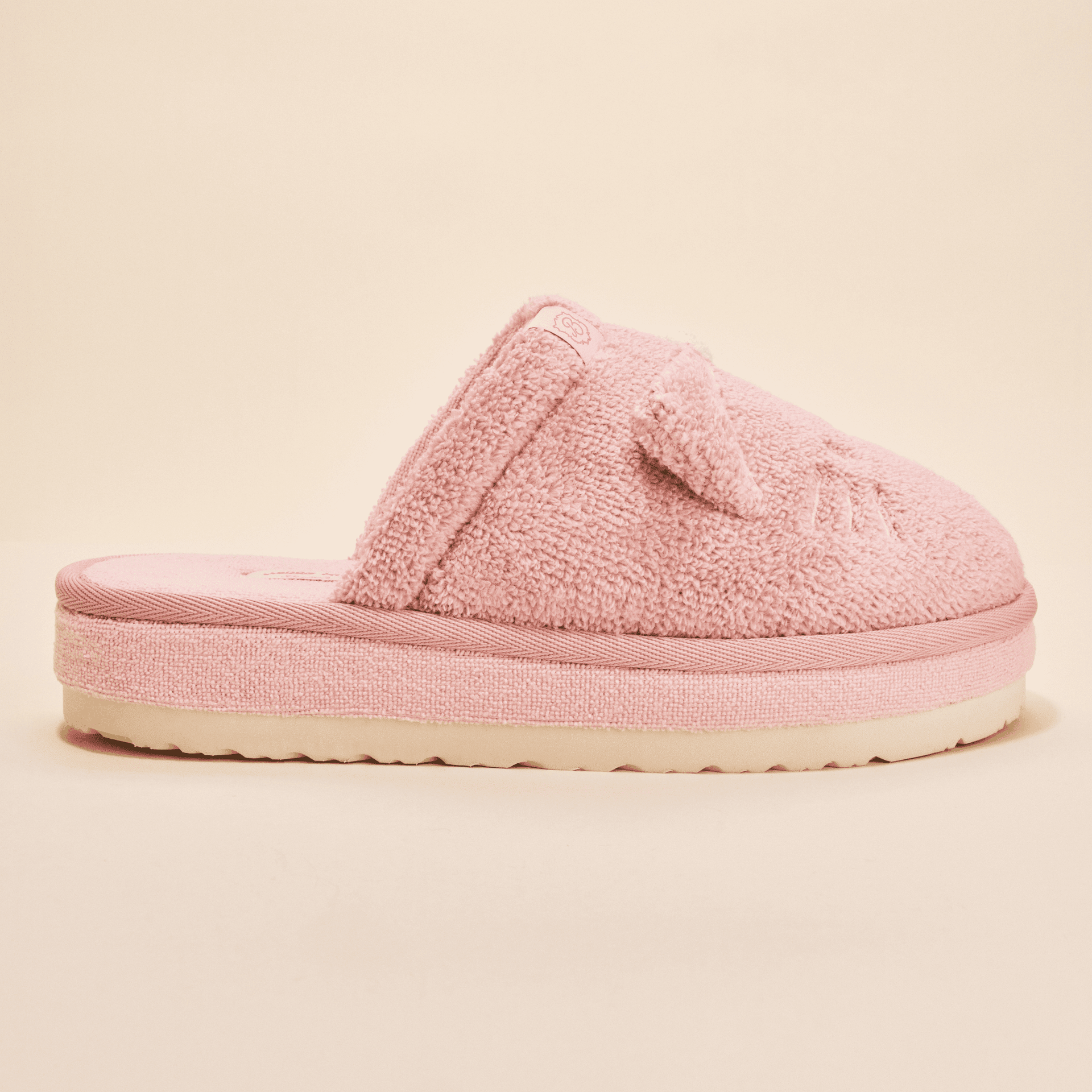Side view of Essential XXL Hello Kitty slipper showing pink terry upper with 3D ears and bow and thick sole