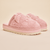 Front three-quarter of pink Hello Kitty terry slippers with 3D ears, embroidered face, and thick platform sole